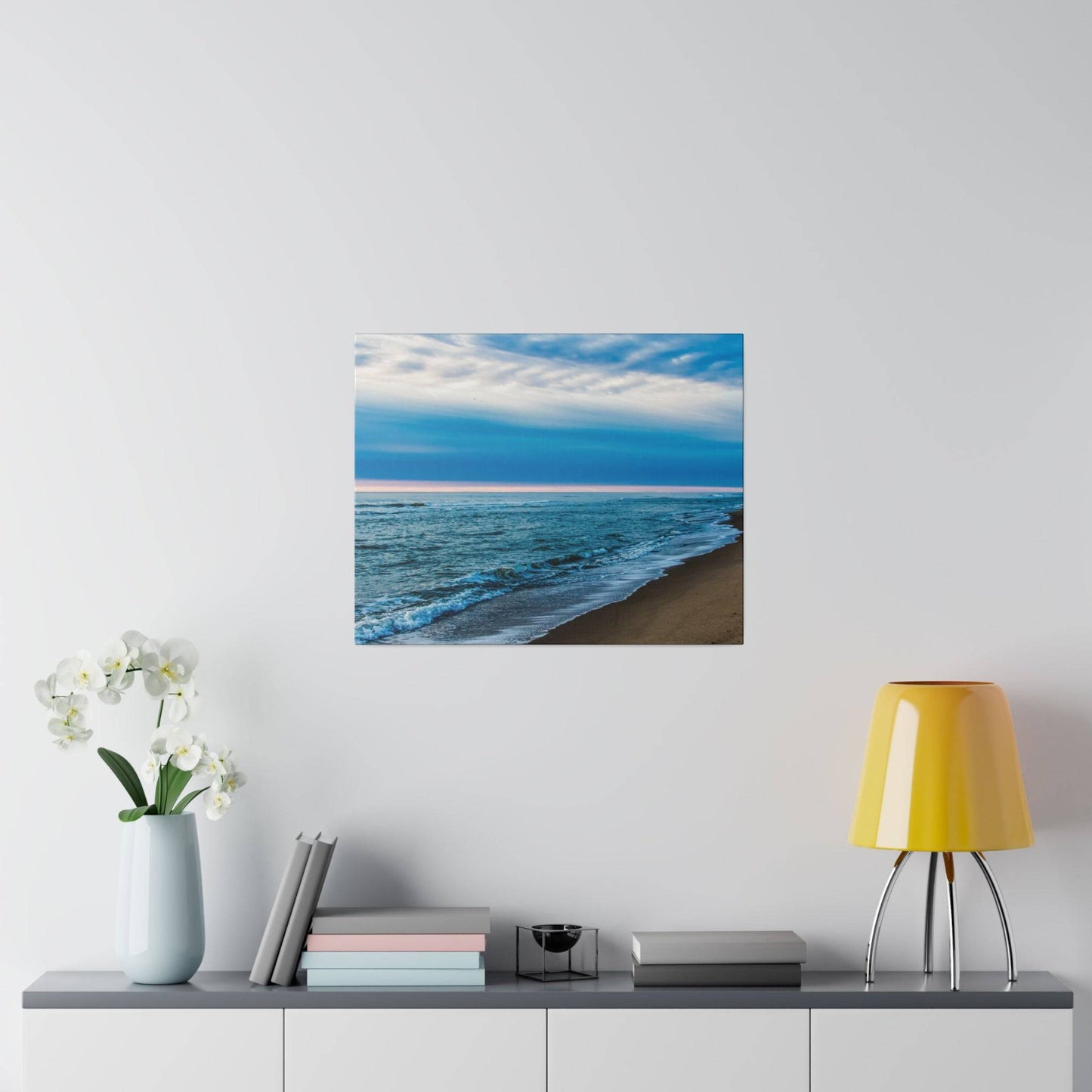a picture of a beach with waves coming in from the ocean