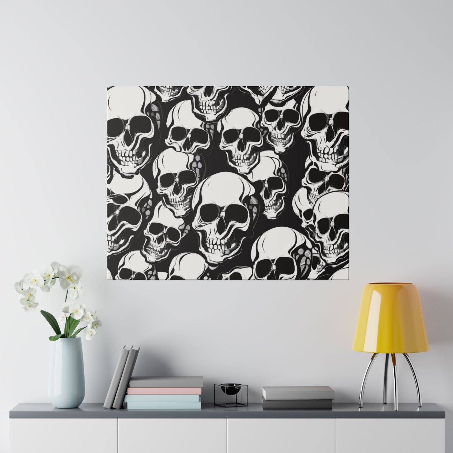 Square wall art featuring a dense pattern of white skulls on a black background.