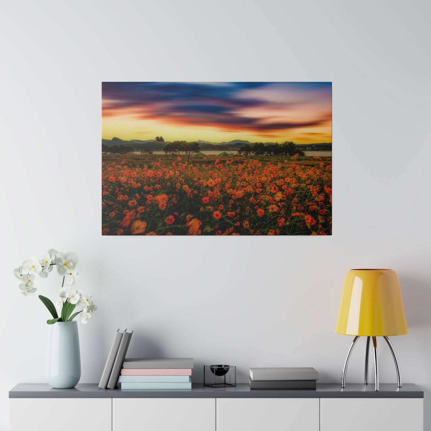 A meadow of flowers at dusk, with the last rays of the sun casting a soft, warm glow over the vibrant blossoms, creating a tranquil scene.