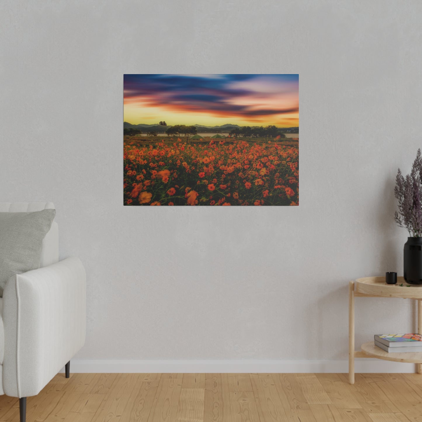 A breathtaking view of a sunset over a field of flowers, with the sky painted in shades of orange and purple, casting a beautiful glow over the landscape.