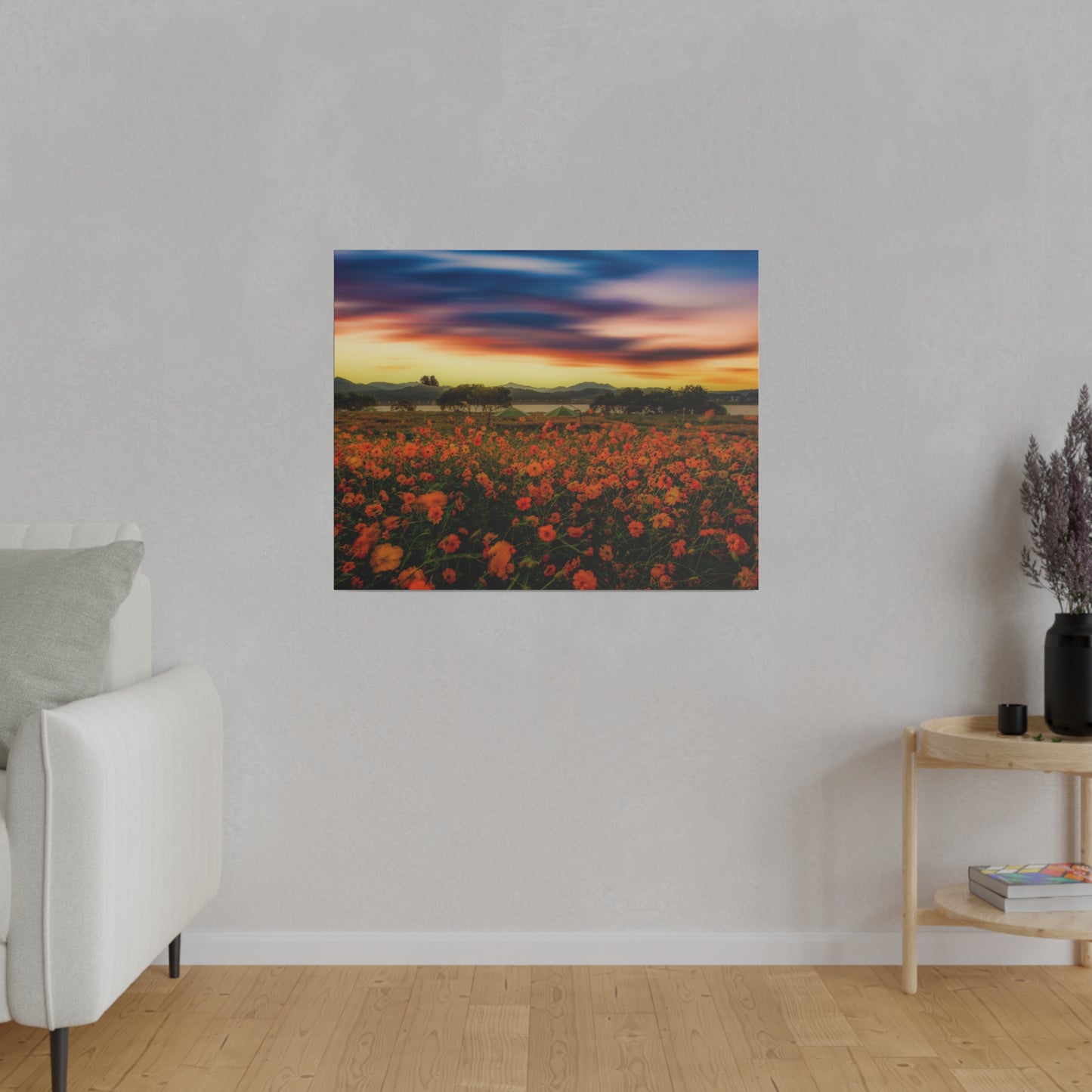The sun sets over a field in full bloom, highlighting the vivid colors of the flowers and creating a picturesque scene of natural beauty.