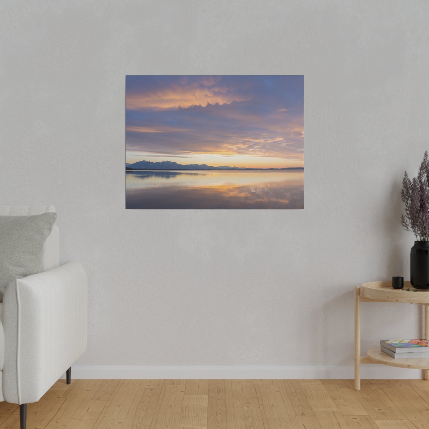 A tranquil reflection of the sunset on a calm lake, with the sky transitioning from orange to purple. The peaceful scene captures the beauty of dusk.