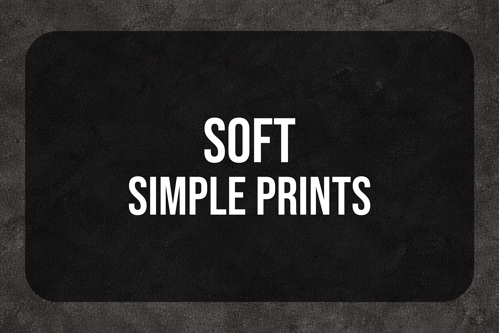dark stone background showing Soft Simple Prints with industrial wall texture