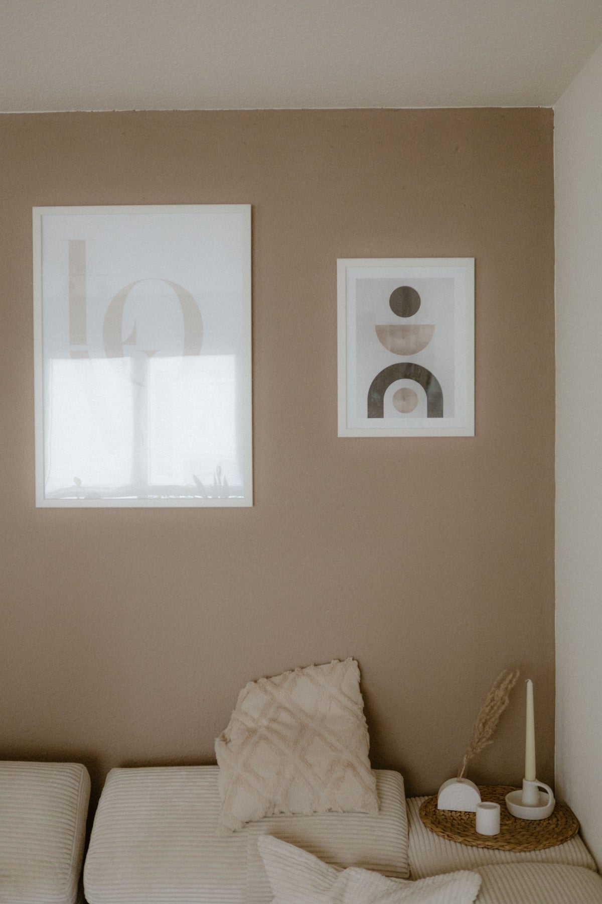 Beige living room with abstract prints and soft neutral furnishings