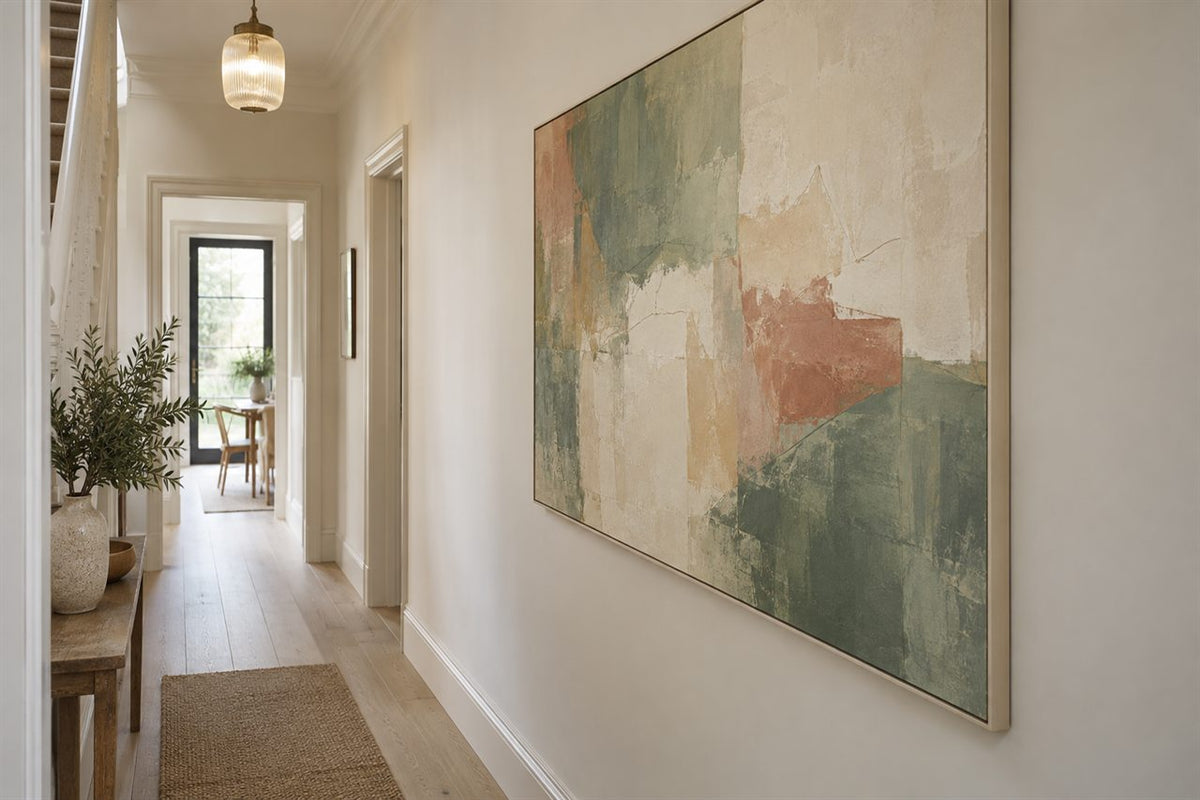 A bright hallway with a large muted abstract canvas on the long wall