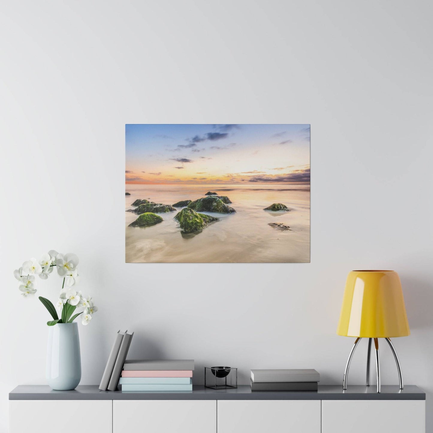 a painting of a sunset over a beach