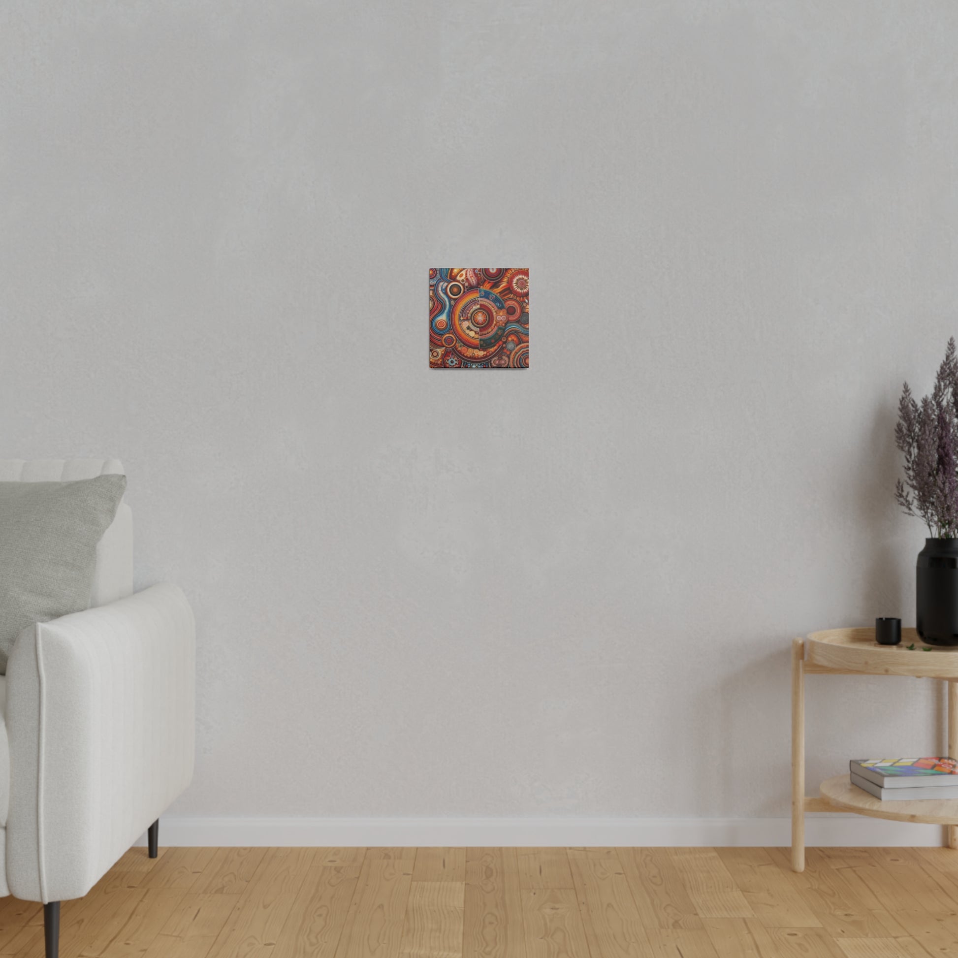 Small square abstract painting with red, orange, and blue swirls hangs on a light gray wall in a minimalist living room.