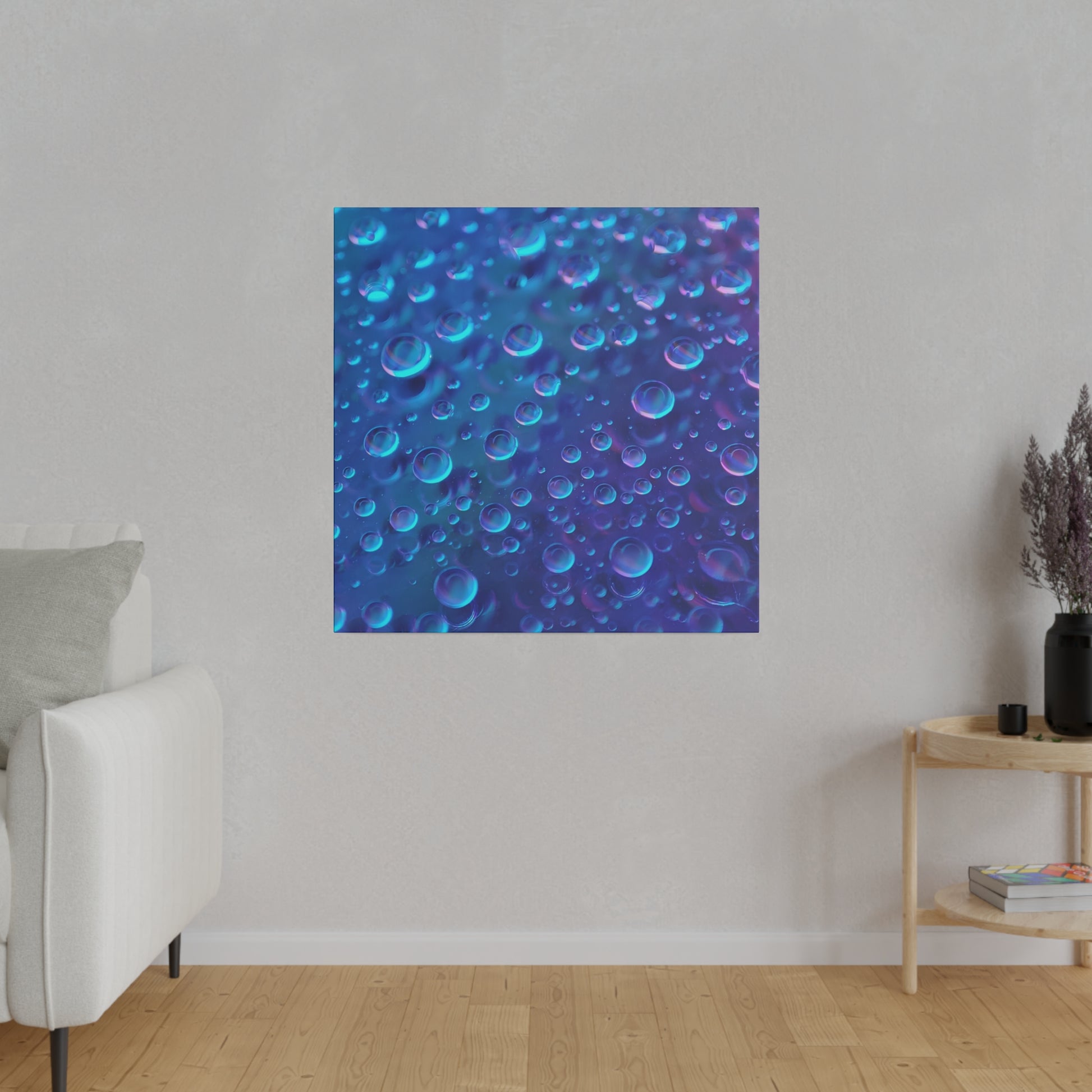 Square blue abstract art print featuring numerous bubbles in varying sizes on a gray wall.