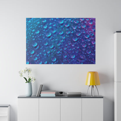 Blue abstract wall art featuring numerous bubbles hangs above a white cabinet with a yellow table lamp and vase of white orchids.