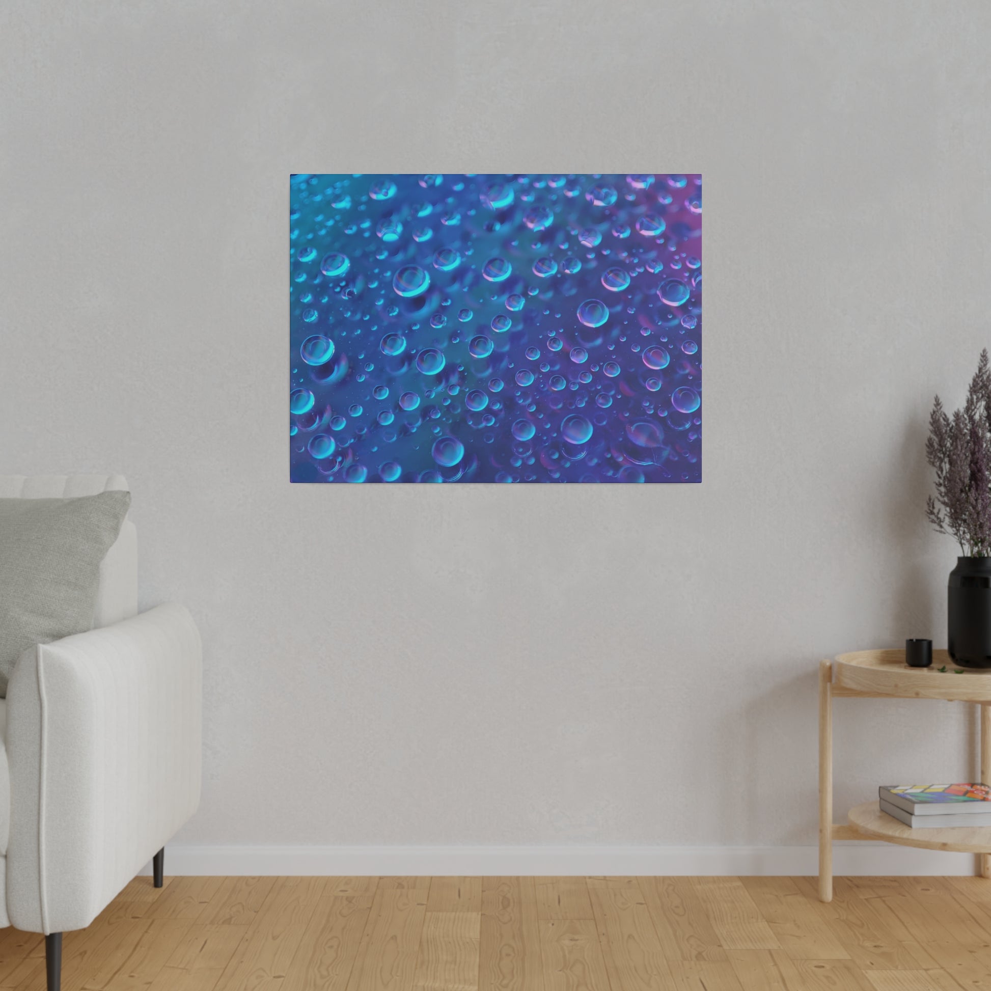Blue abstract wall art with numerous teal and violet bubbles on a dark blue background mounted on a light gray wall.