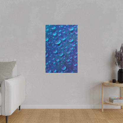 Blue vertical poster featuring numerous translucent blue bubbles hangs on a light gray wall in a living room.