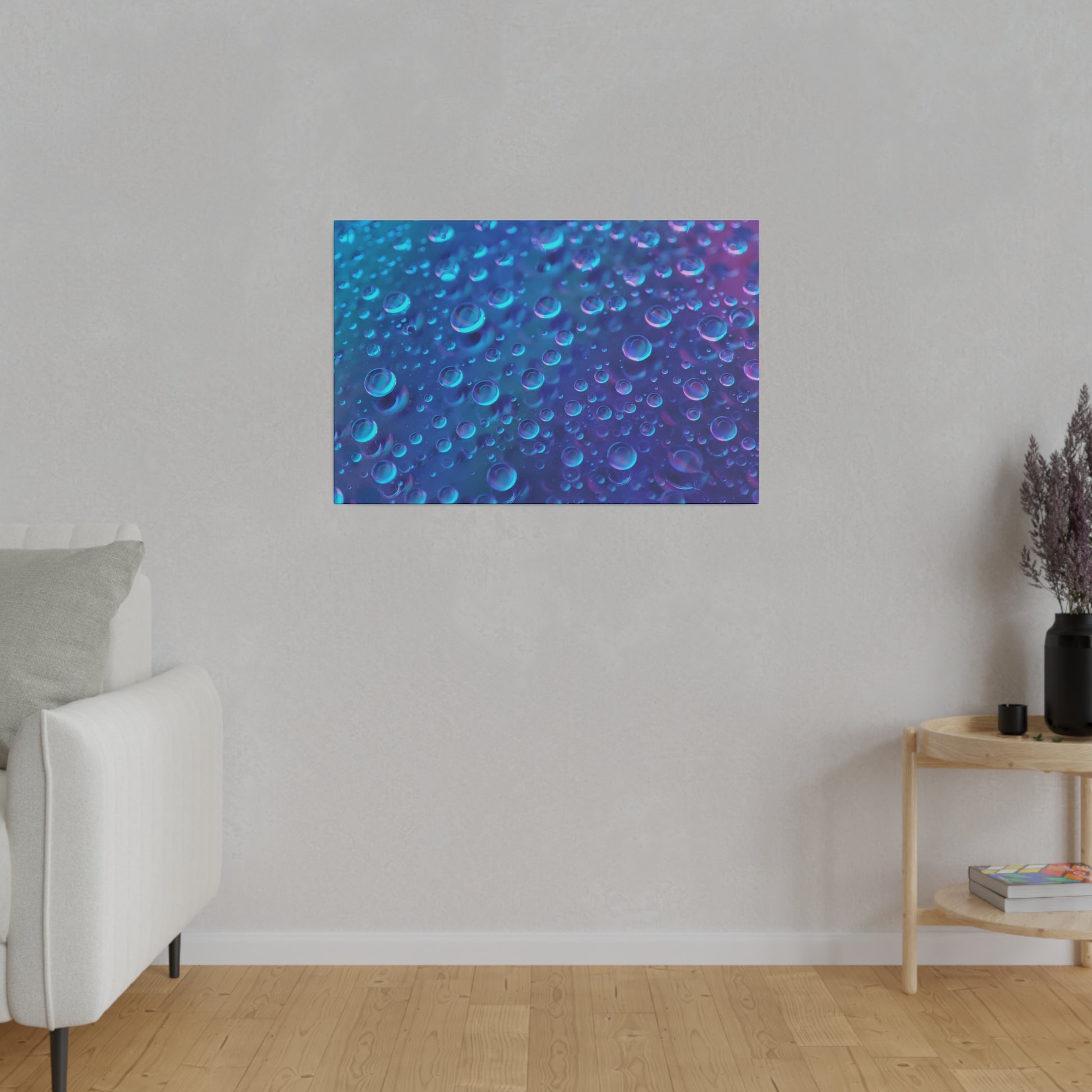 Canvas wall art in blue and purple with a bubble pattern, hanging on a light gray living-room wall.