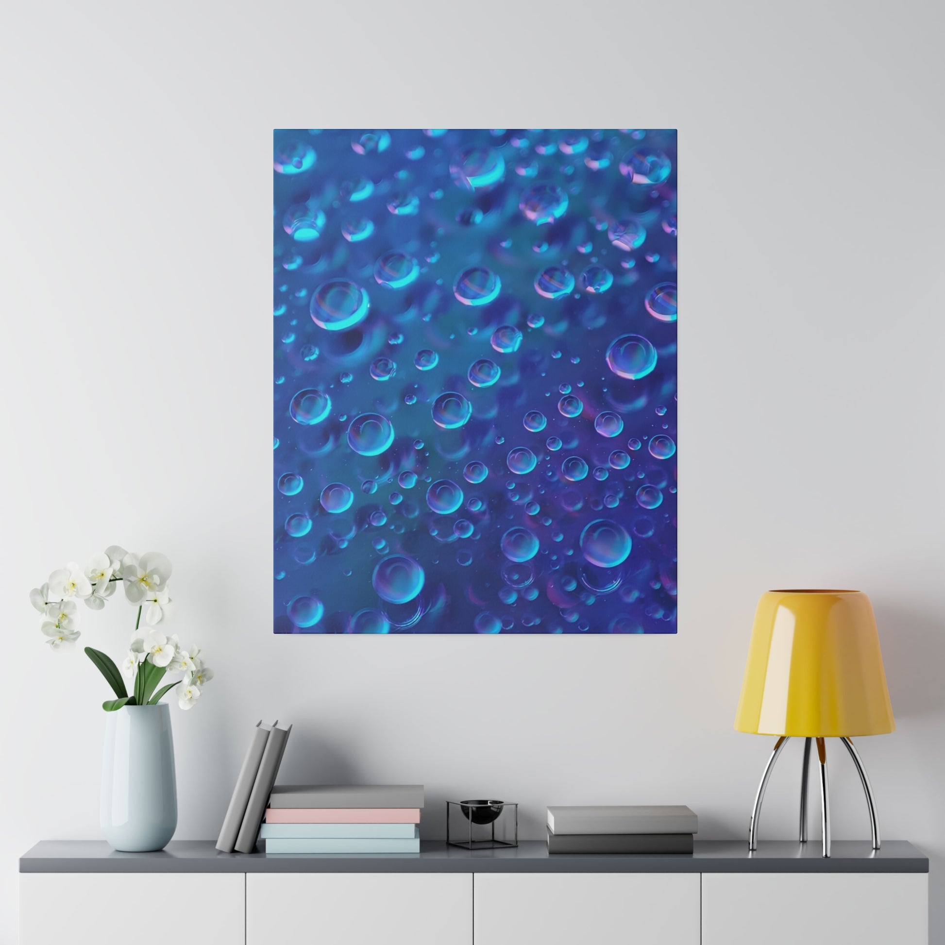 Blue close-up photograph of numerous translucent bubbles floating in a liquid with purple highlights.