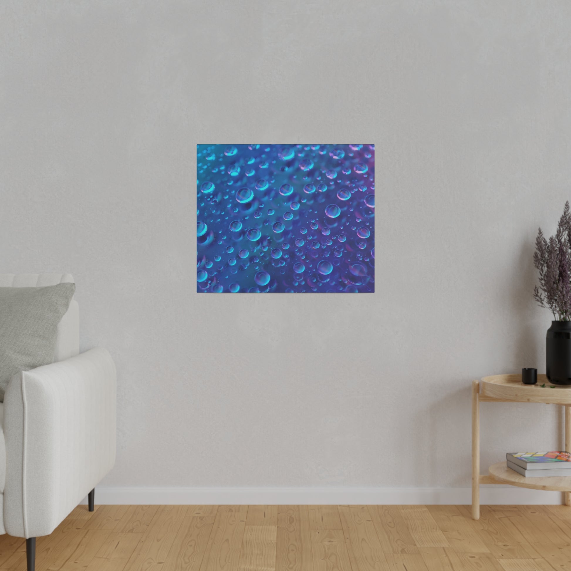 Blue abstract art print featuring numerous aqua bubbles on a textured wall, mounted above a small wooden shelf.