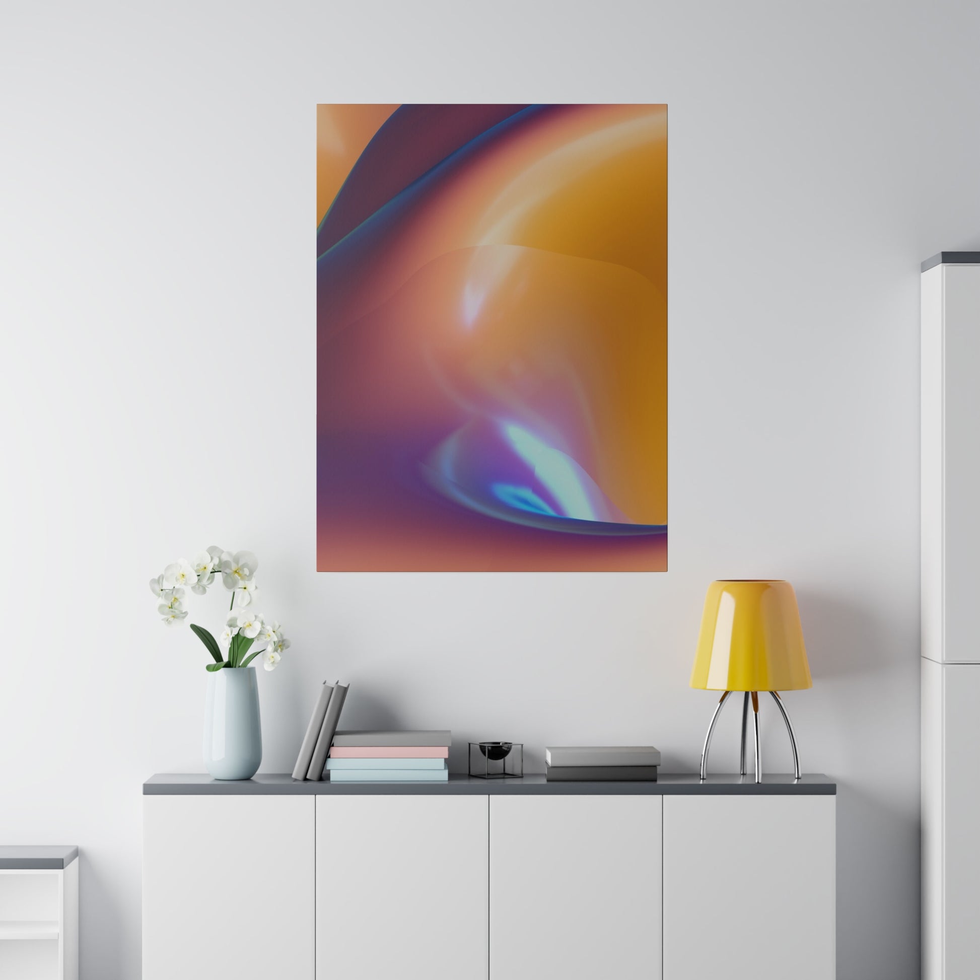 Abstract orange and purple gradient poster mounted on a white wall above a white cabinet.