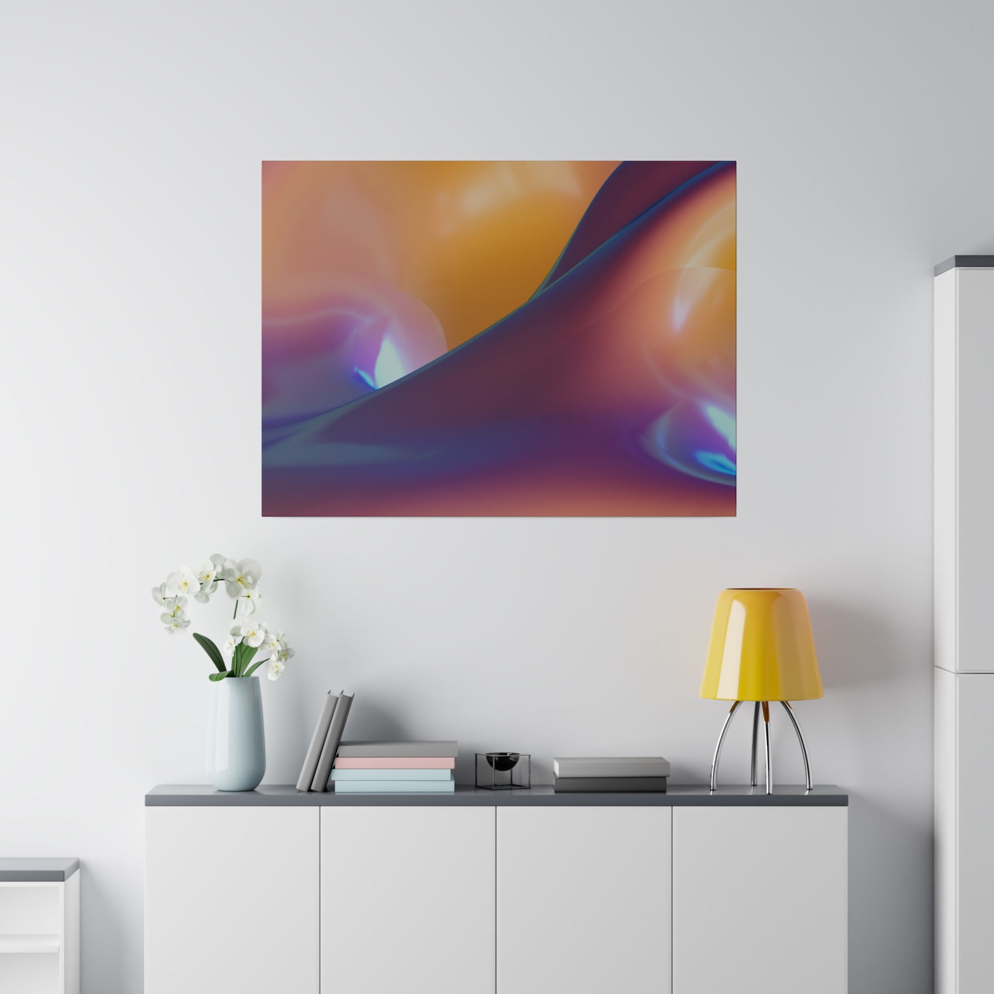Abstract colorful wall art with orange, purple, and blue gradients hangs above a white sideboard in a modern room.