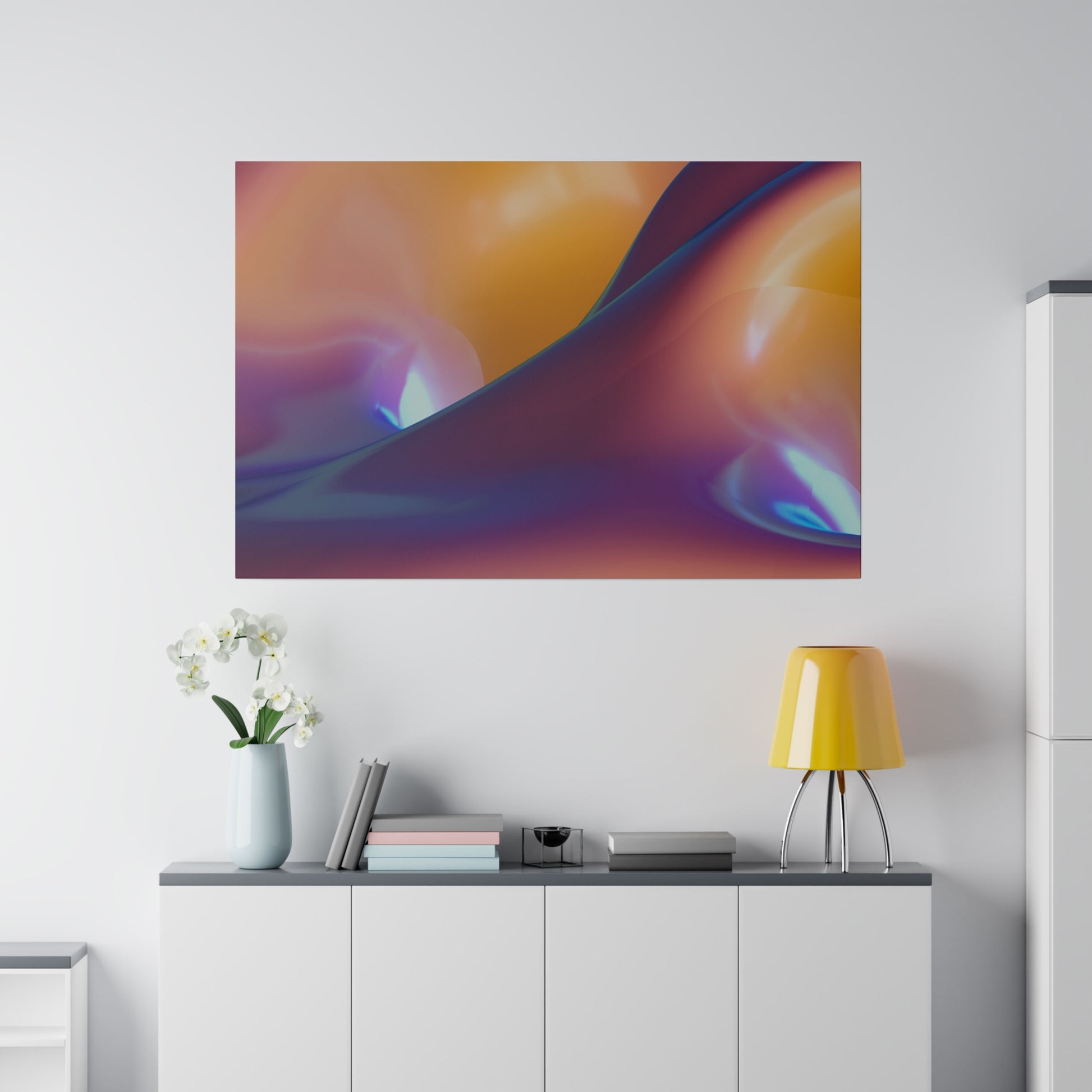 Abstract colorful wall art with orange, purple and blue swirls above a white cabinet, yellow lamp, and