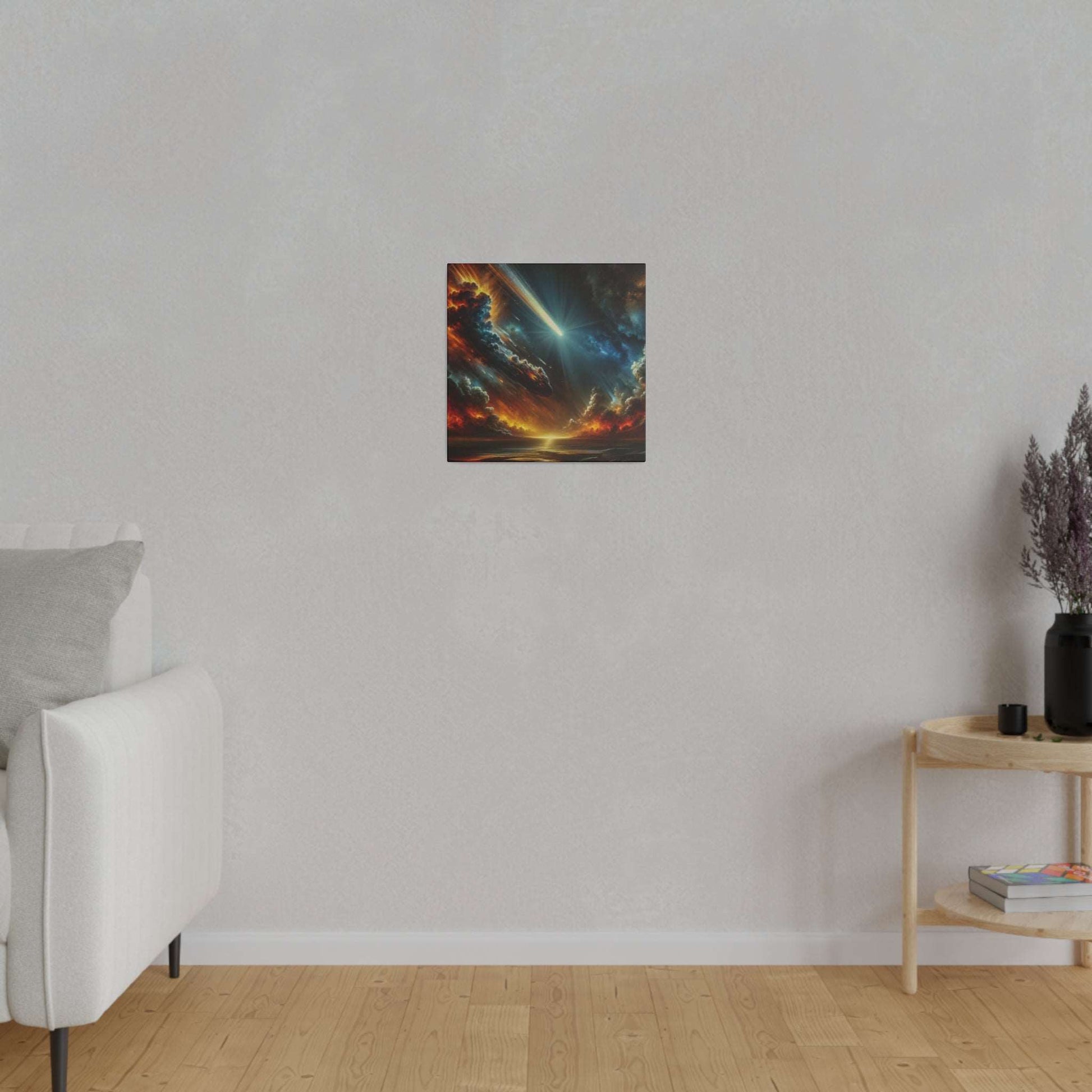 Small square canvas painting of a dramatic fiery sunset with a blue light beam on a light gray wall.