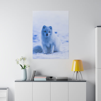 Vertical wall poster of a white Arctic fox sitting in snow, mounted above a white sideboard in a modern room.