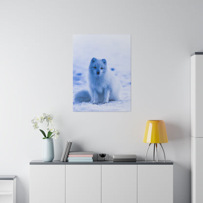 Poster of a blue Arctic fox sitting in snow, hung above a white cabinet in a modern room.
