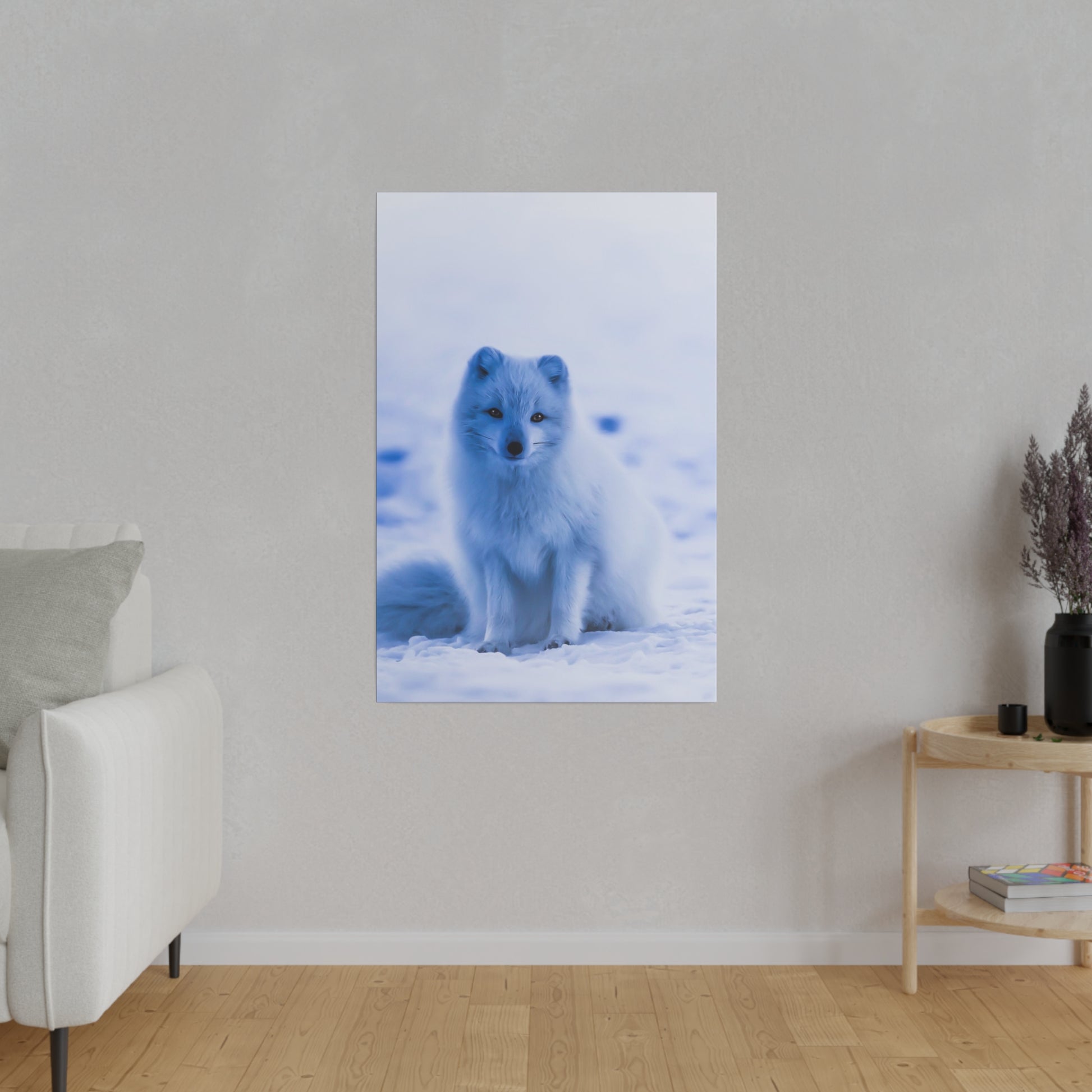 An Arctic fox blends into the snowy background with its white fur, showcasing nature’s perfect camouflage.