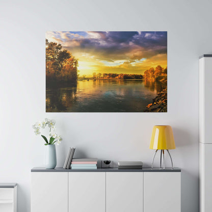 Large wall art print depicting a sunset over a calm river with tree-lined banks.