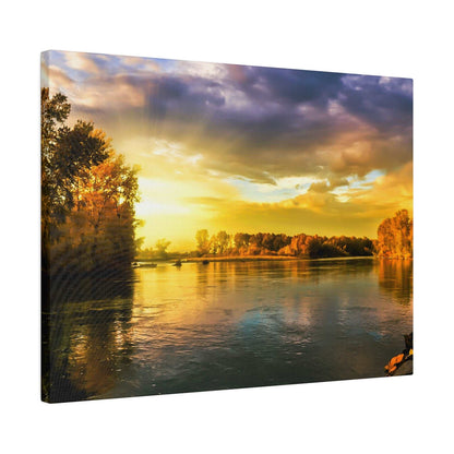 Canvas print of a river landscape at sunset, with golden light reflecting on calm water and trees along the banks.