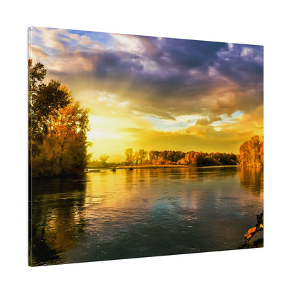 River scene at sunset with golden sky, orange autumn trees along the banks and calm, reflective water.
