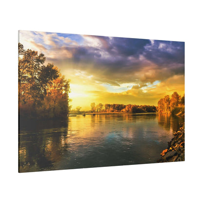 River scene at sunset with golden light reflecting off calm water; trees with autumn foliage line the riverbanks.