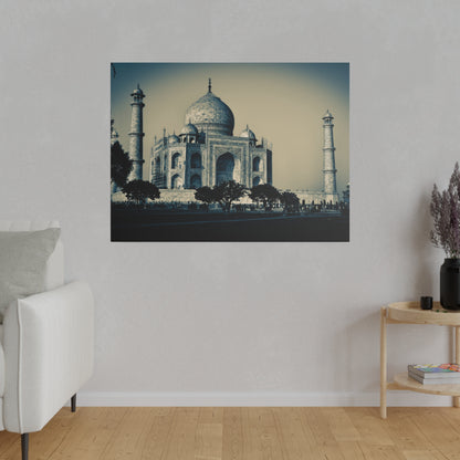 Blue-toned photo of the Taj Mahal showing its central dome, arches, two minarets, and trees in front.