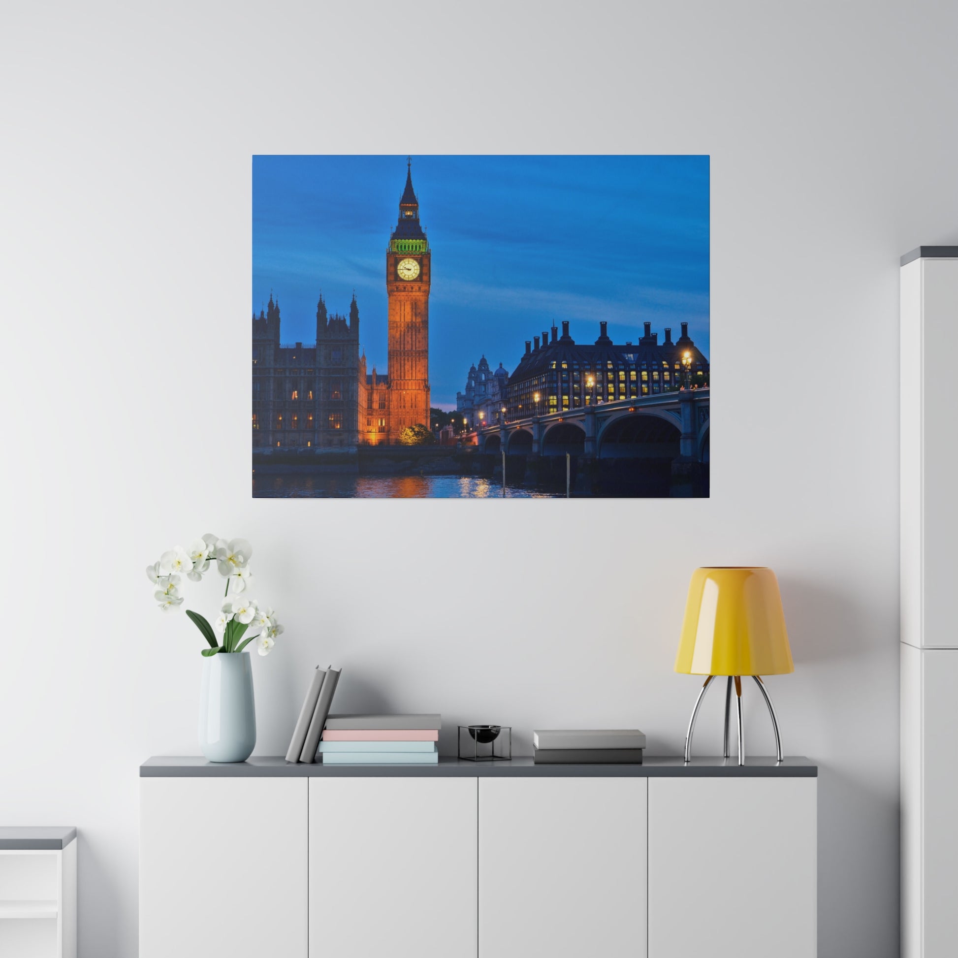 Big Ben, one of London’s most recognizable landmarks, illuminated during the night, standing tall and majestic against a clear evening sky.