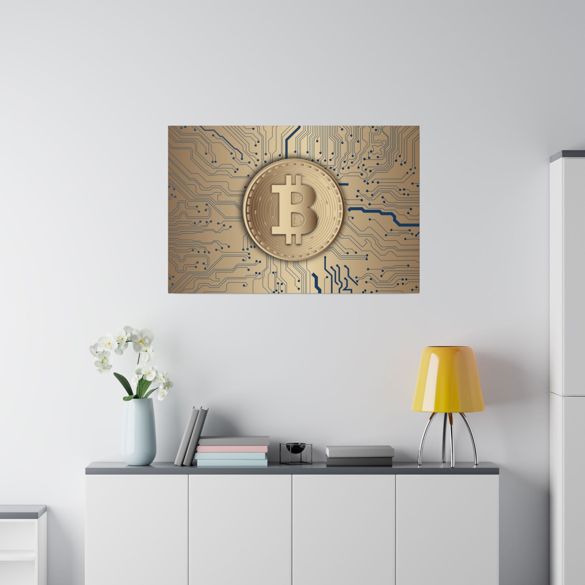 Gold Bitcoin coin framed artwork on a beige circuit-board background, hung above a white cabinet with a yellow lamp.