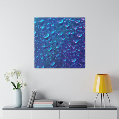 Blue abstract canvas with bubble-like circles on a light wall above a console table with a pale vase, books, and a yellow lamp.