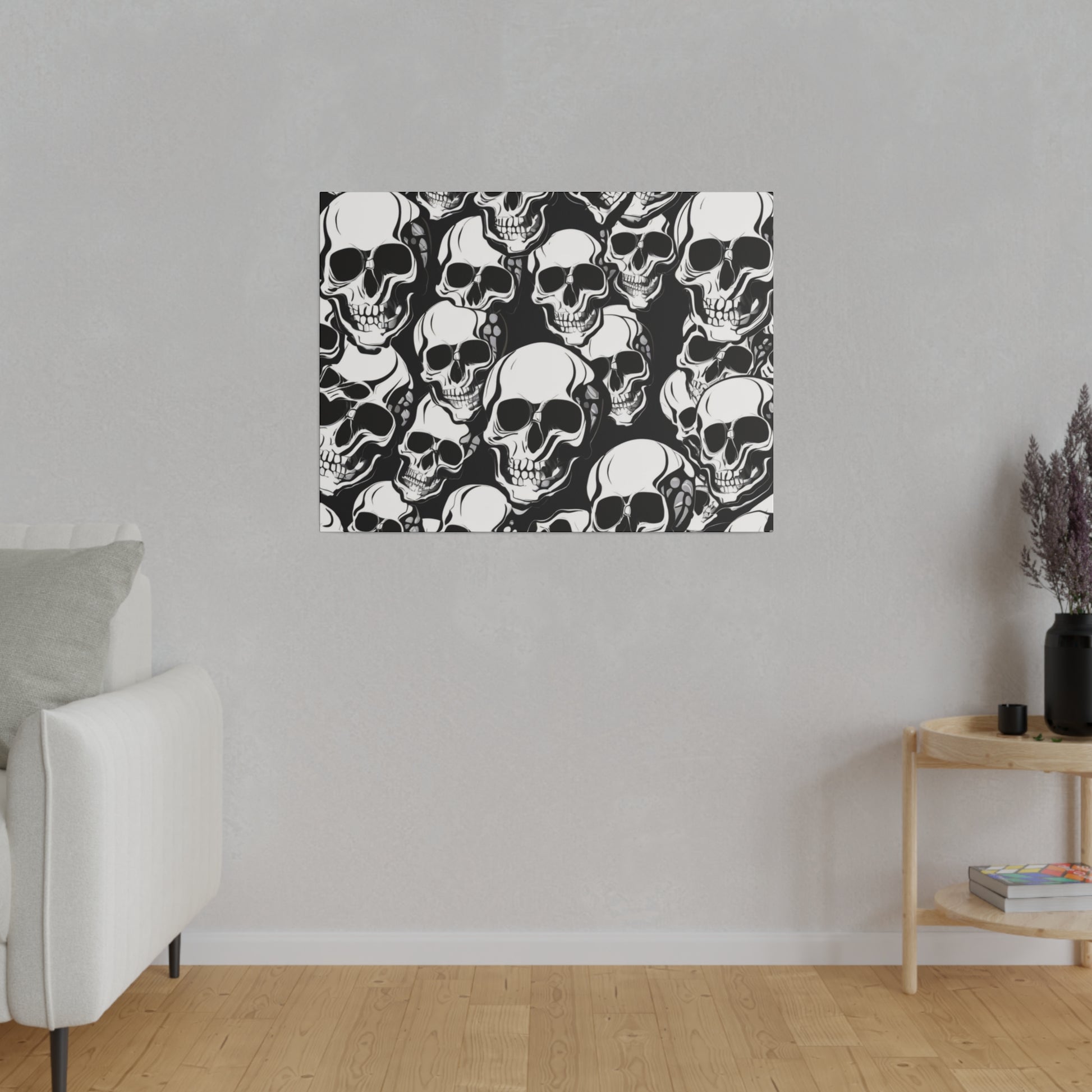 Rectangular wall art with a dense black-and-white skull pattern mounted on a light gray wall.