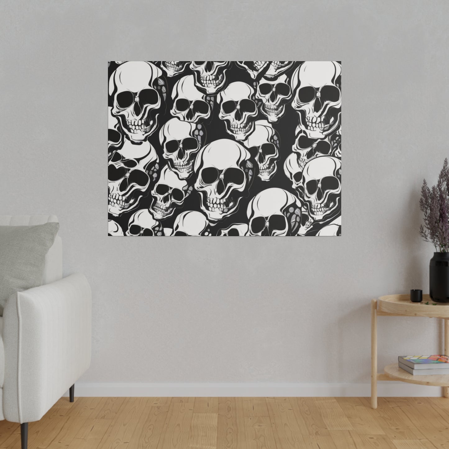 Square wall art print with a dense black and white skull pattern hung on a light gray wall.