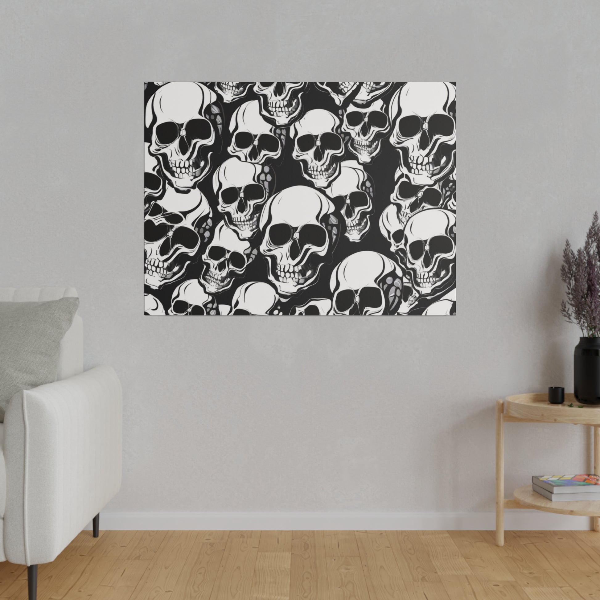 Square wall art print with a dense black and white skull pattern hung on a light gray wall.