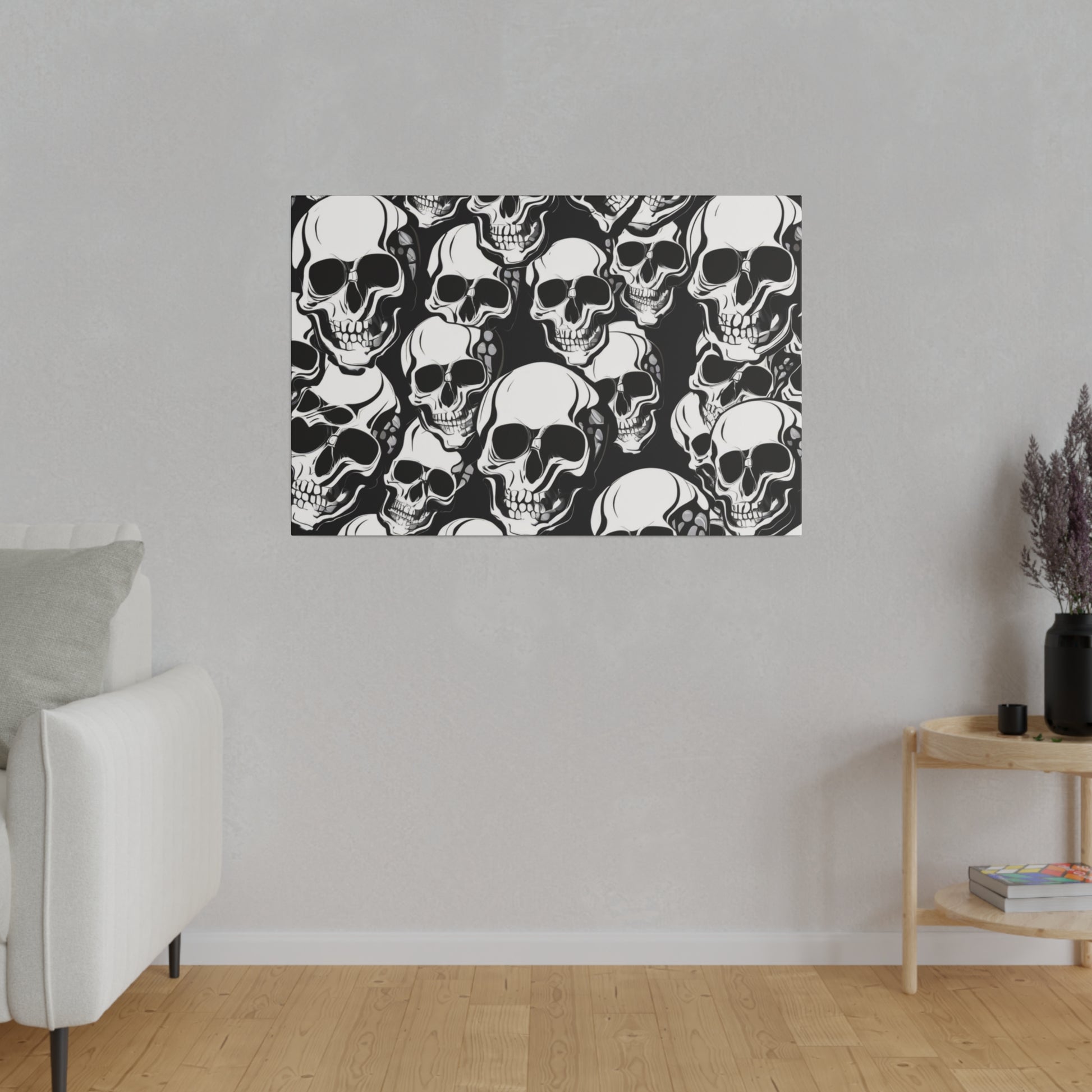 Rectangular black-and-white skull-pattern art print hanging on a light gray wall in a living room.
