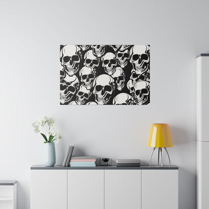 Dense black-and-white skull-pattern wall art mounted above a white cabinet with a yellow lamp and vase.