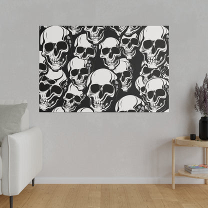 Wall art showing a dense pattern of white skulls on a black background hanging on a light gray living room wall.