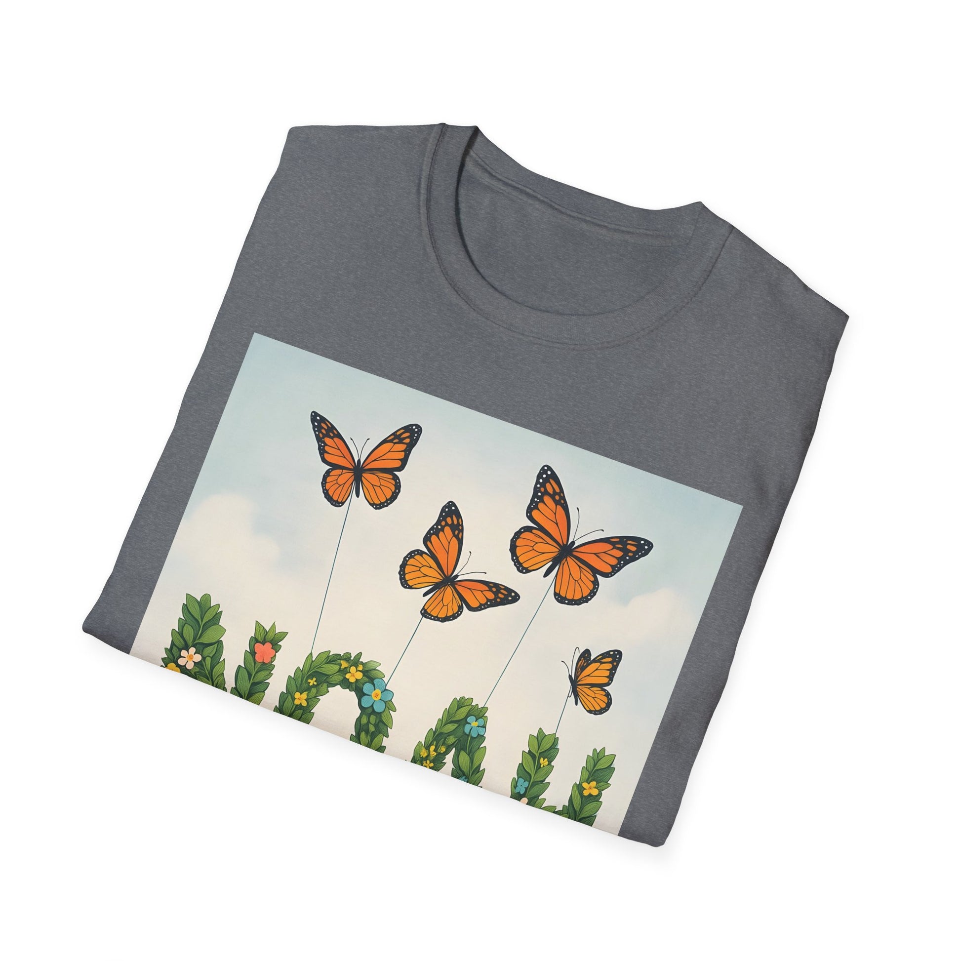 Grey T-shirt with a rectangular graphic of orange monarch butterflies on tall stems above green vines and a pale blue sky.