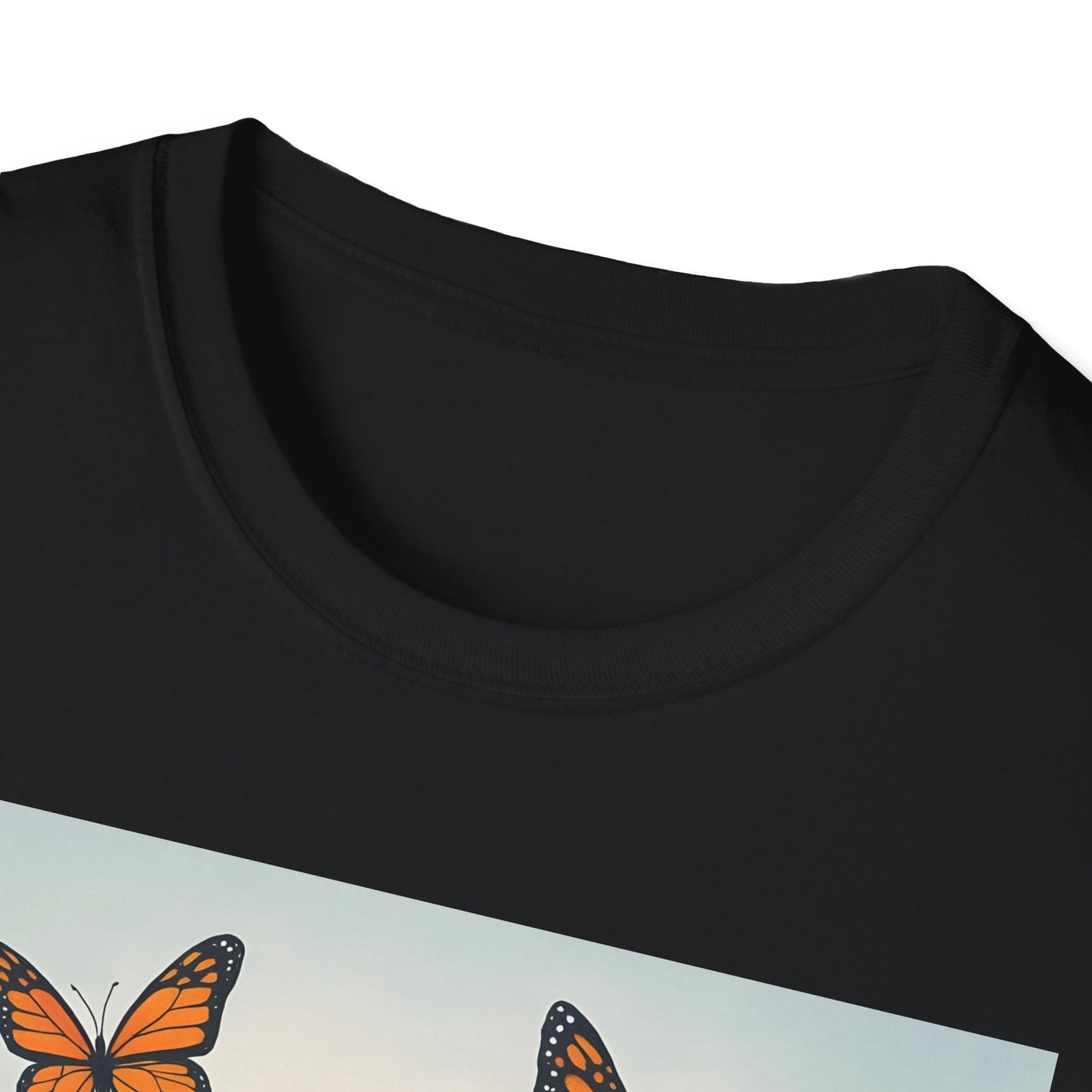 Close-up of a black crew-neck T-shirt with a light blue graphic panel featuring orange monarch butterflies.