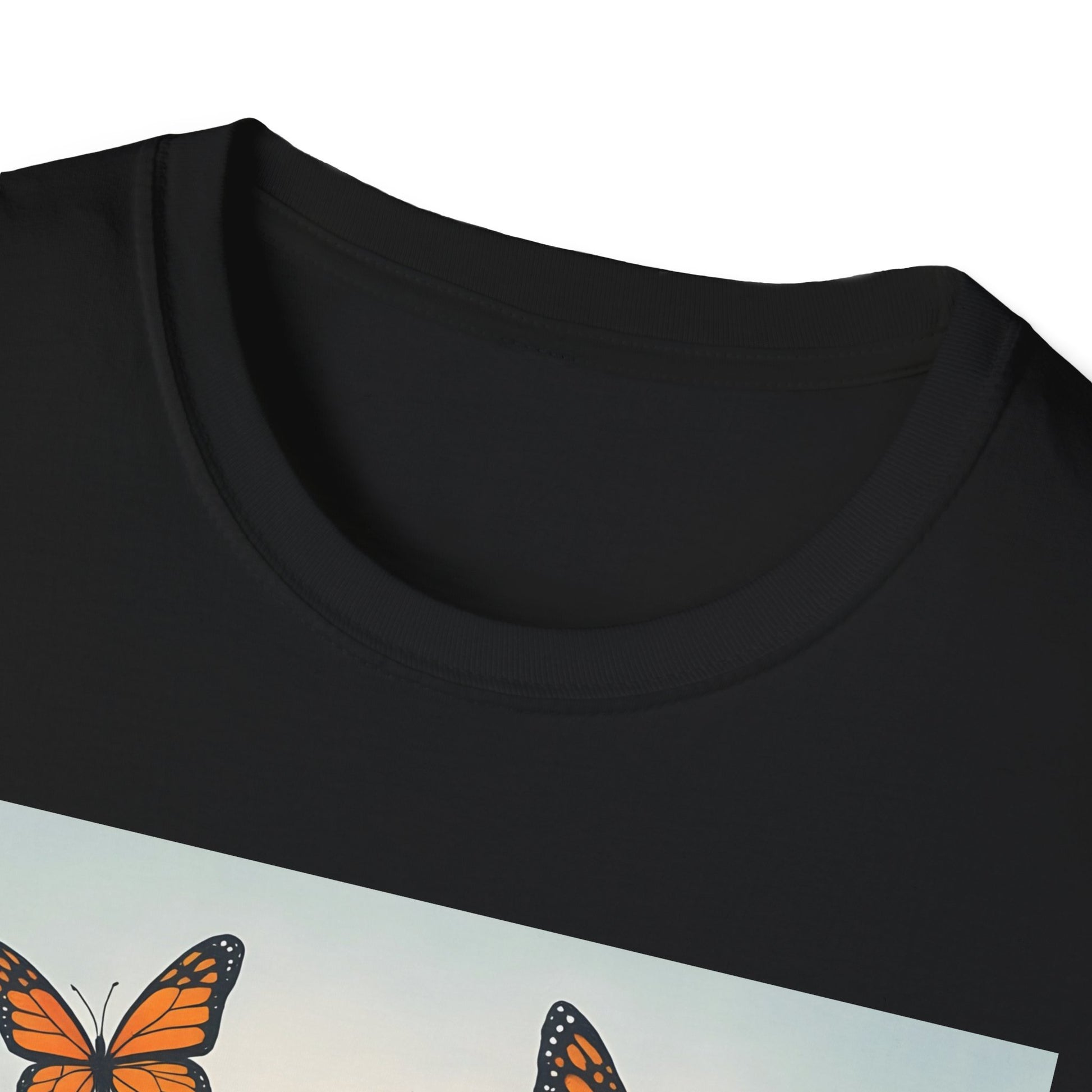 Close-up of a black crew-neck T-shirt with a light blue graphic panel featuring orange monarch butterflies.