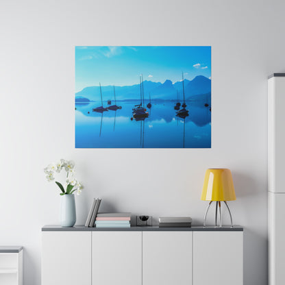 Blue-toned photo print of sailboats on a calm lake with a blue mountain range in the background.
