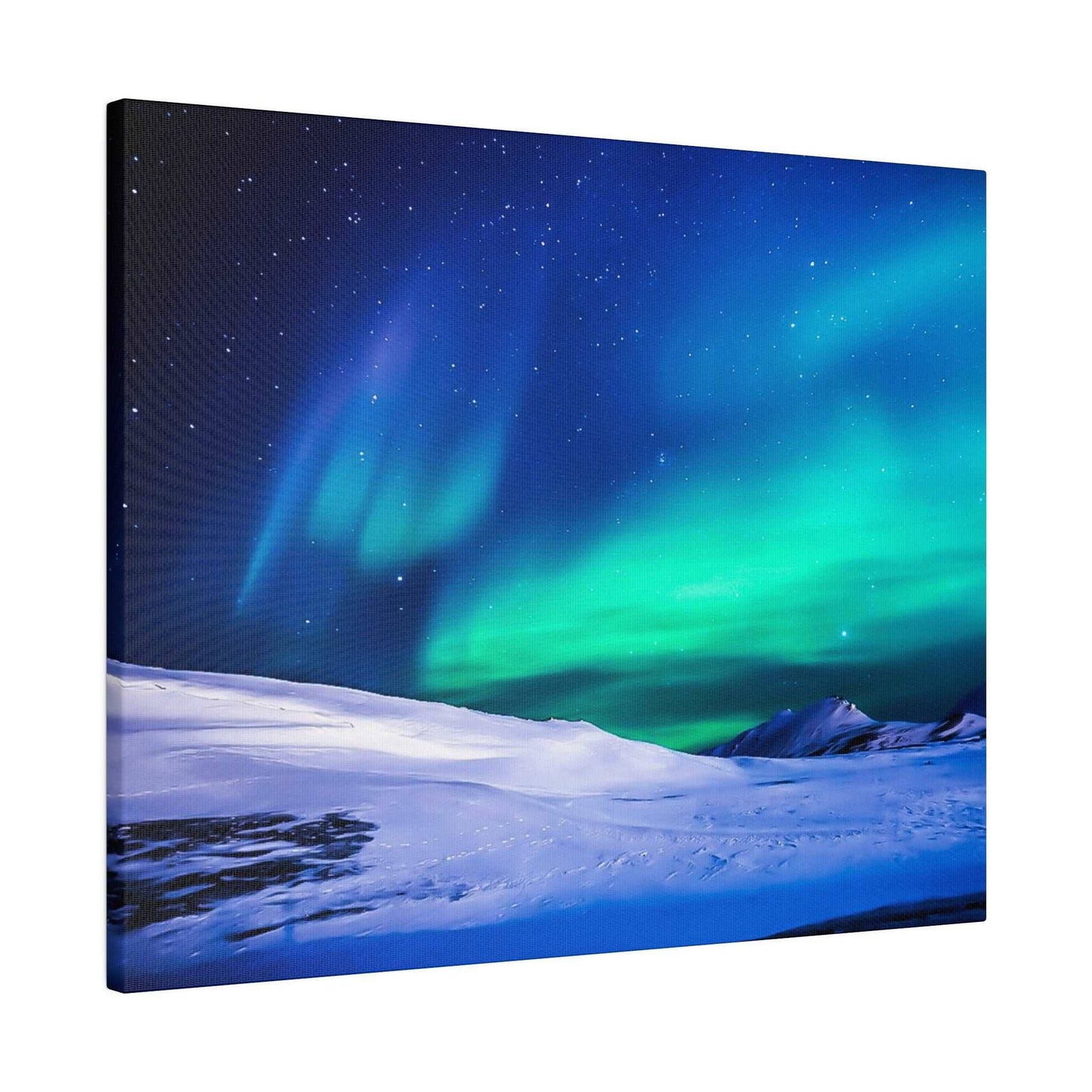 Canvas wall art depicting the green and blue aurora borealis across a snow-covered landscape at night.
