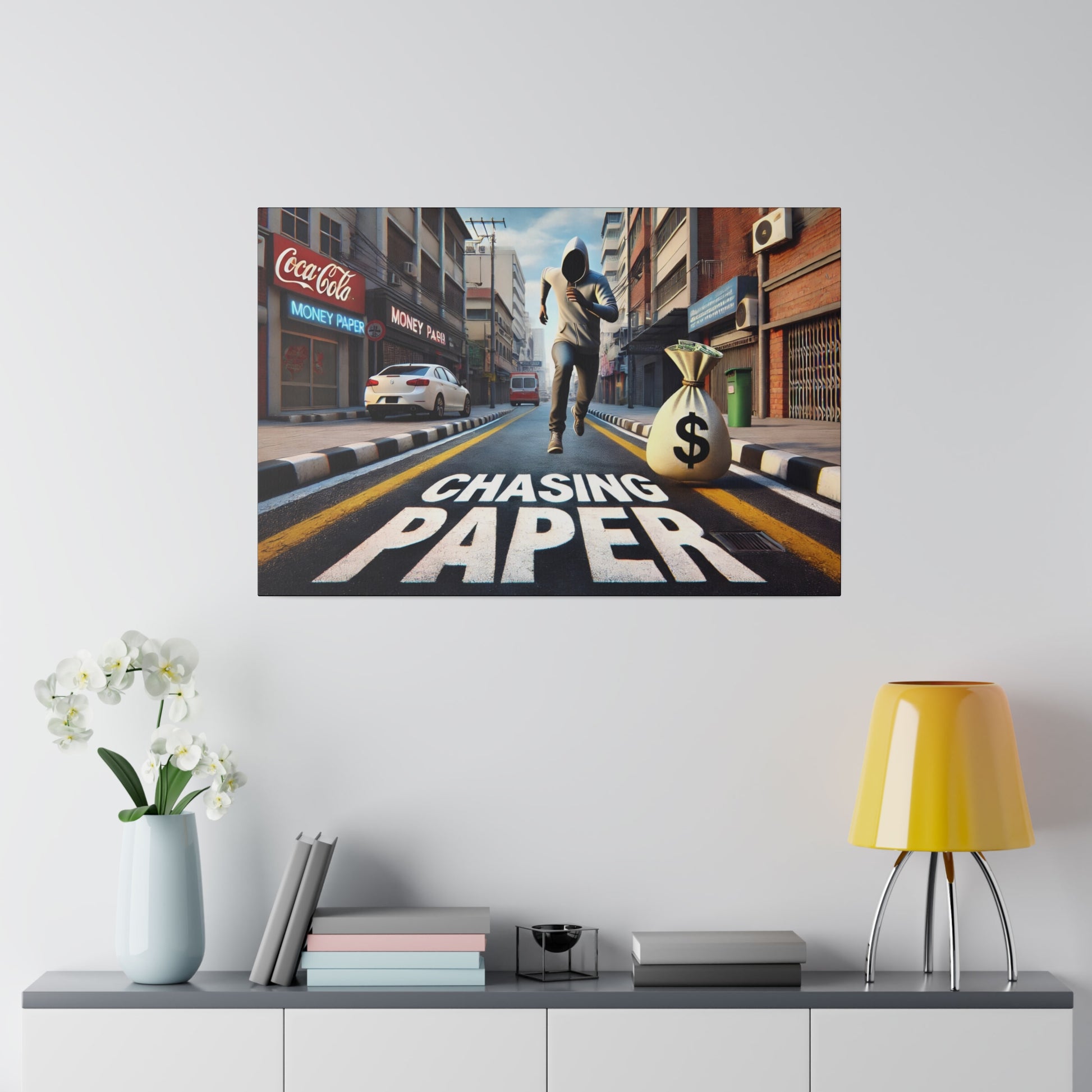 Poster titled 'Chasing Paper' on a city street shows a man running toward a money bag with a dollar sign.