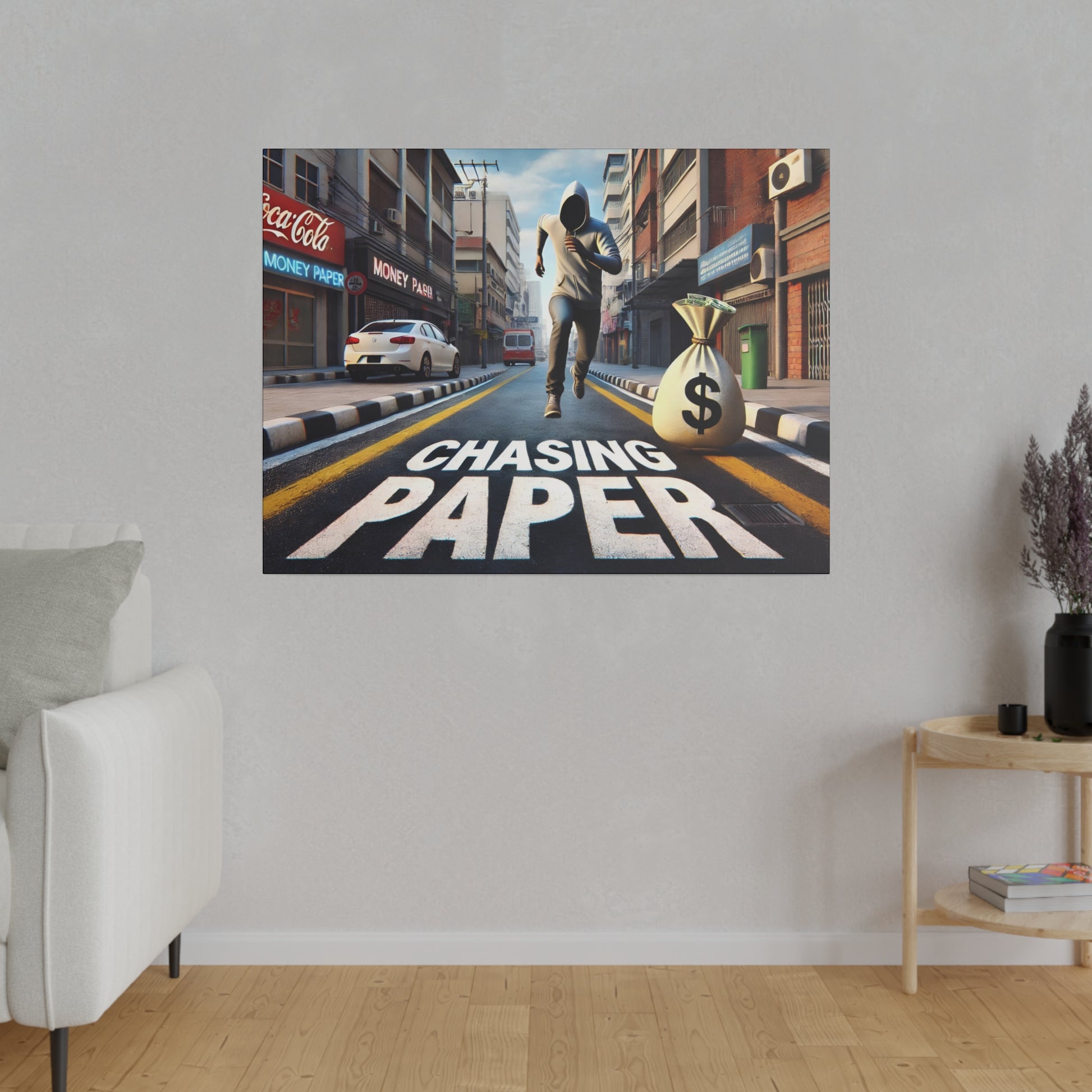Wall art depicting a runner in a hoodie chasing a bag of money down a city street with “Chasing Paper” text.