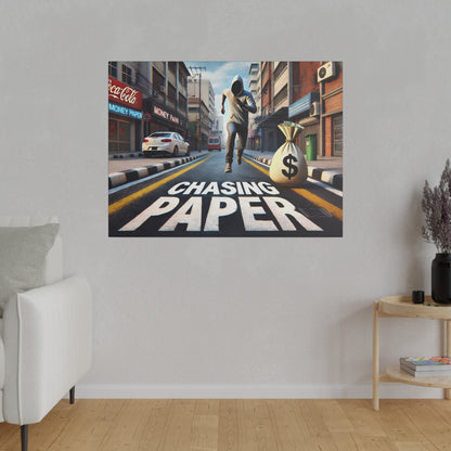 Wall art depicting a runner in a hoodie chasing a bag of money down a city street with “Chasing Paper” text.