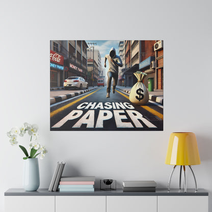 Square wall art showing a man in a hoodie running down a city street with a money bag and 'Chasing Paper' painted on the road.