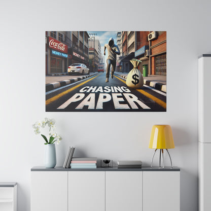 Poster on a white wall shows a man chasing a money bag down a city street, with 'CHASING PAPER' painted on the road.