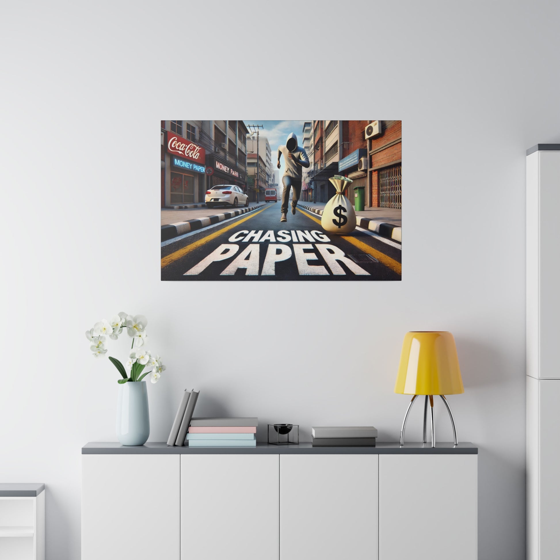 Colorful wall art depicting a city street with a runner and a large money bag, text "Chasing Paper" on the road.